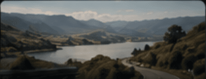 A road winding through hills to the coast